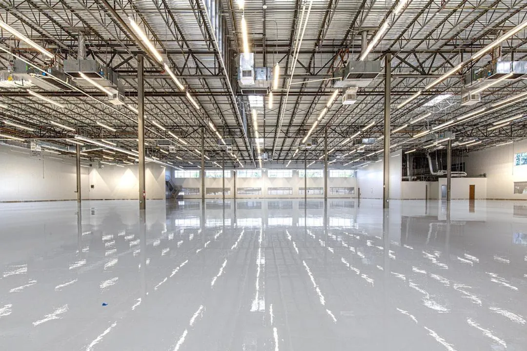Clean industrial warehouse floor with a glossy clear epoxy coating