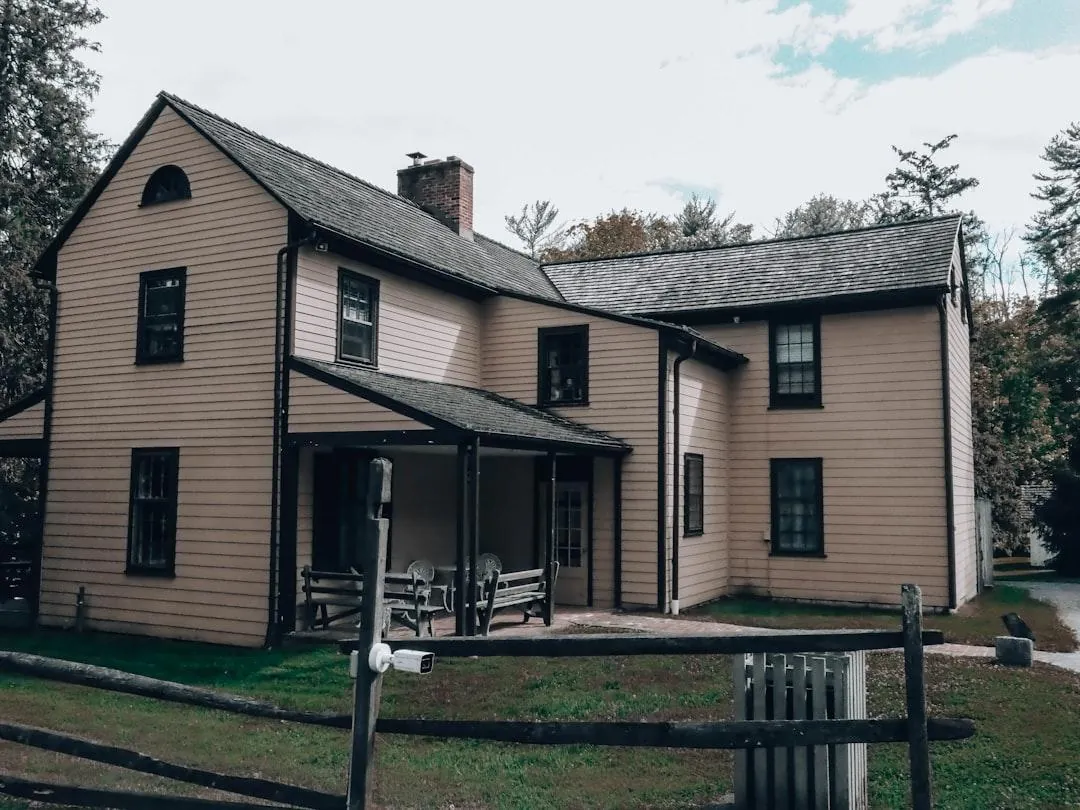 Freshly painted two-story home exterior with dark trim